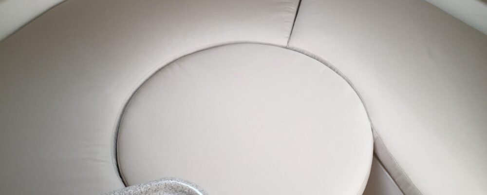 Custom interior cushions for the seating/bed area made with Sunbrella® Linen upholstery fabric