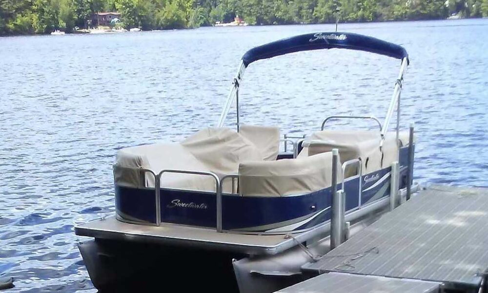Custom covers made with Sunbrella® linen keep the upholstery in great shape on this pontoon boat
