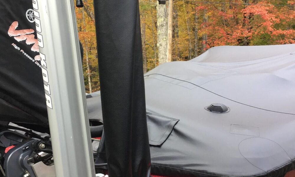 Custom bass boat cover, with removable straps, for trailering or in the sling at the dock
