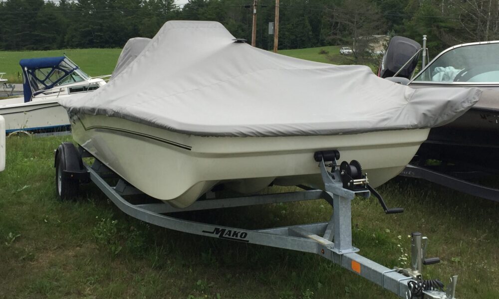 Mako 17 custom boat cover built using Top Notch fabric. The cover is contoured to accommodate the trolling motor. by Kate's Custom Sewing
