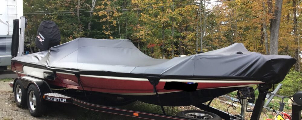 Custom bass boat cover, with removable straps, for trailering or in the sling at the dock