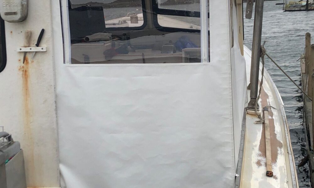 This custom winter back enclosure helps keep the crew warmer when out hauling lobstah
